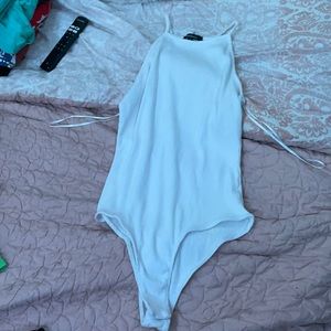 a white halter body suit